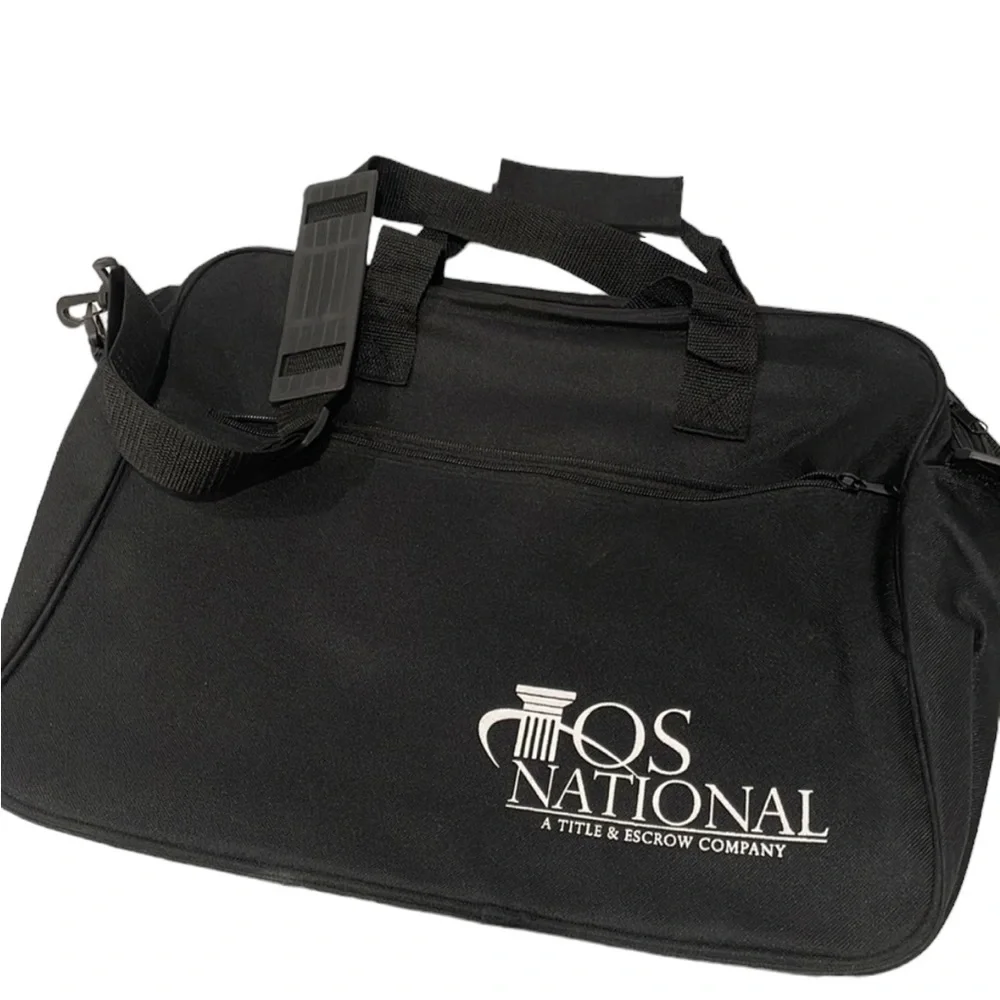 Black canvas messenger bag with front zip pocket. New.